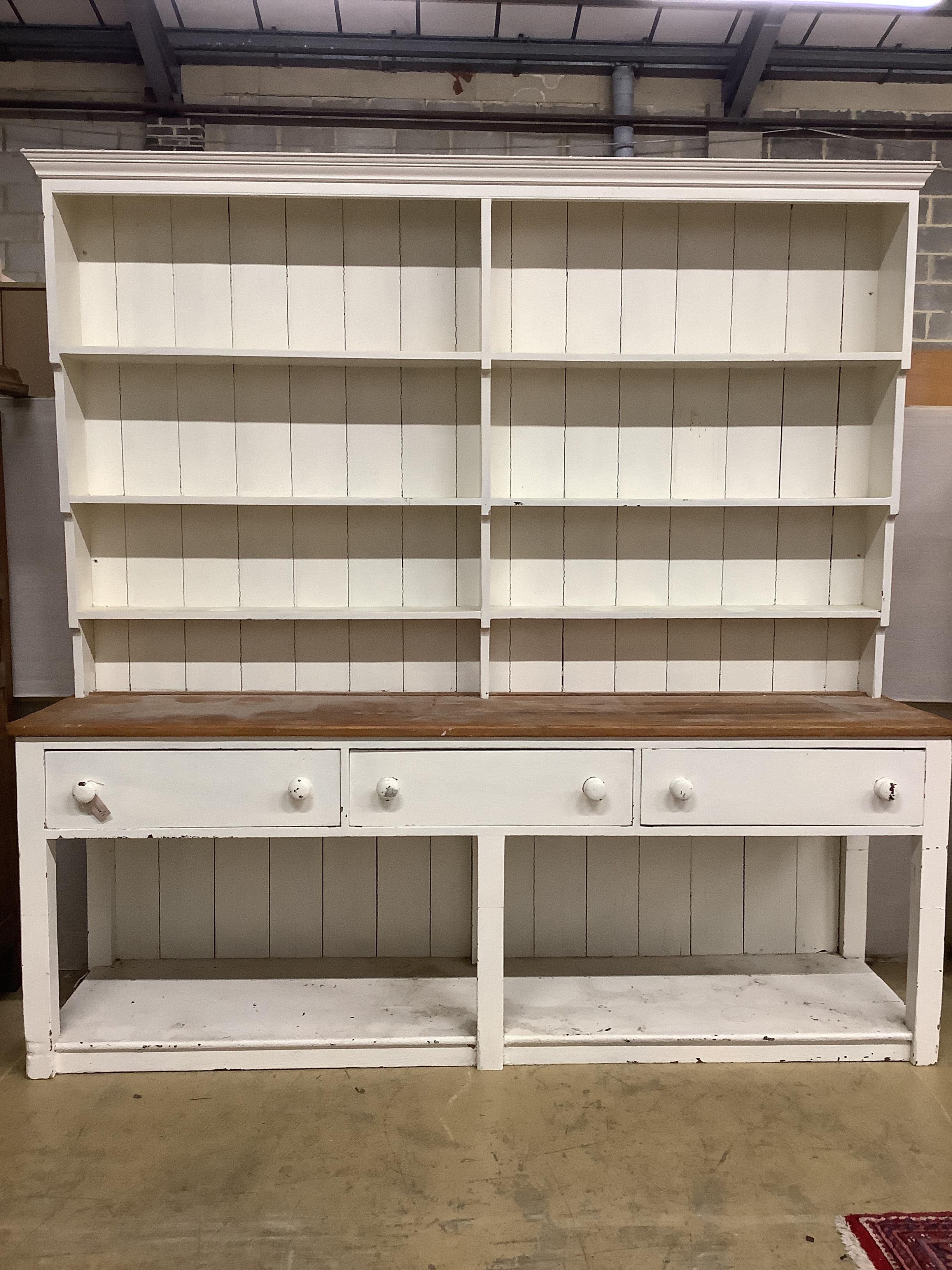 A large Victorian part painted pine potboard dresser, with boarded rack, width 244cm, depth 62cm, height 242cm